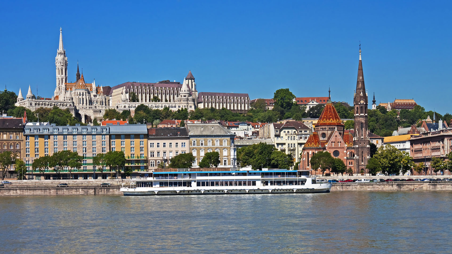 River cruise ship on the Danube below Matthias Church and Fisherman’s Bastion, Budapest